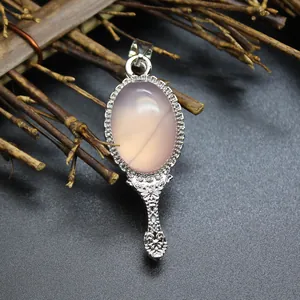 Vintage magic mirror pendant with natural pink agate stone and intricate silver details