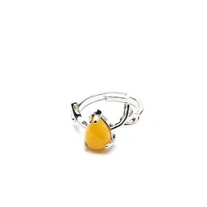 Silver-tone adjustable ring featuring a yellow teardrop stone and deer antler prongs.