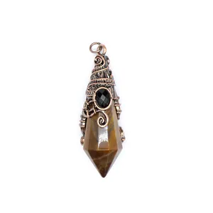 Detailed view of a vintage bronze wire wrapped wizard hat shape natural stone pendant.