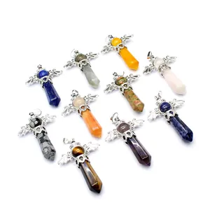 Selection of natural crystal hexagonal column pendants with silver wing filigree caps.