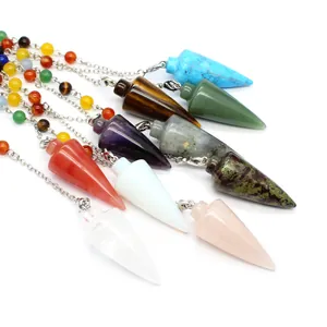 Variety of conical crystal pendulums with chakra bead chains for dowsing and healing.