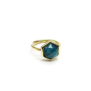 Close-up detail of hexagonal blue natural stone set in a gold-plated adjustable ring.