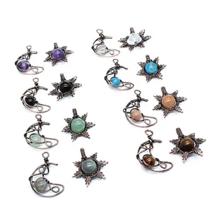 Collection of handmade wire-wrapped natural stone sun and moon pendants in vintage style.