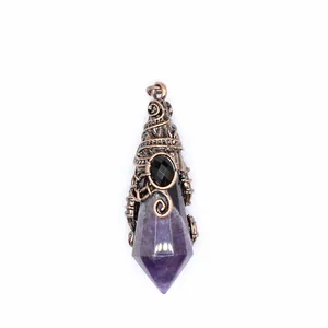 Macro view of a purple amethyst crystal pendant wrapped in ornate copper wire
