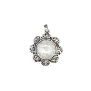 Exquisite vintage antique silver flower pendant featuring a natural white stone inlay.