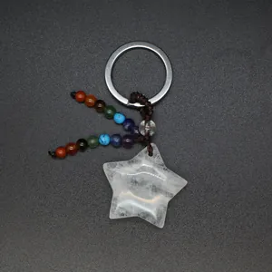 Detailed view of clear quartz star pendant keychain with colorful chakra beads