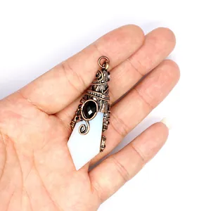Detailed view of faceted natural stone pendant with vintage copper wizard hat filigree design
