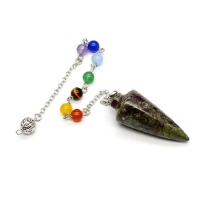 Detailed view of conical crystal pendulum with seven chakra gemstone beads on silver chain