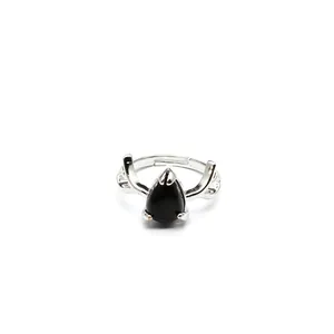 Detailed shot of a silver-toned ring with black water-drop stone and antler design