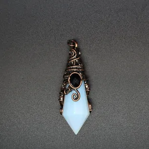 Detail view of the wizard hat faceted crystal pendant with vintage copper wire wrap.