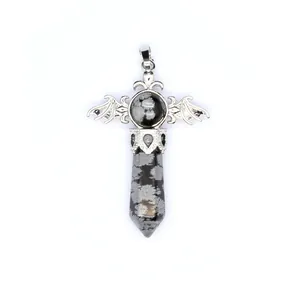 Detailed view of a natural snowflake obsidian hexagonal crystal pillar pendant