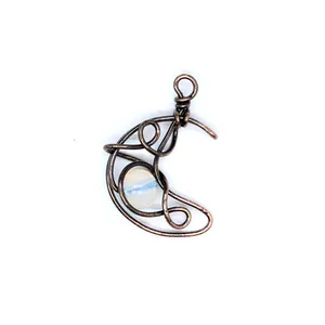 Handcrafted wire-wrapped crescent moon pendant with iridescent natural stone.