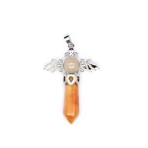 Detail of natural stone hexagonal crystal pillar pendant with decorative silver wings