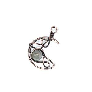 Close-up of handmade wire wrapped crescent moon pendant with natural labradorite stone