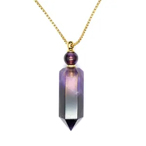 Macro detail of a hexagonal purple crystal perfume bottle necklace with a gold chain.