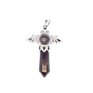 Macro detail of a natural stone hexagonal pillar crystal pendant with silver wings.
