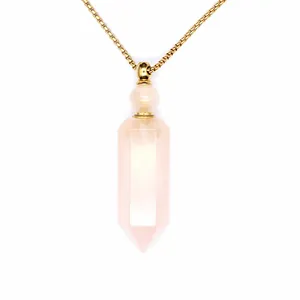 Detailed view of hexagonal pink crystal aromatherapy bottle necklace with gold chain