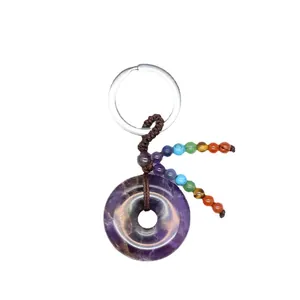 Sleutelhanger van natuurlijke amethist donut met zeven chakra kralen kwast