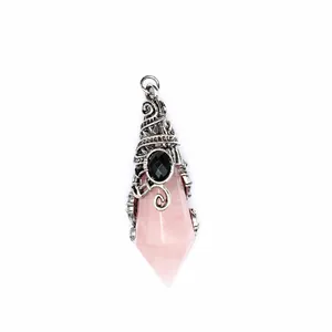 Close-up of a pink faceted crystal pendant with vintage silver wizard hat metal cap.