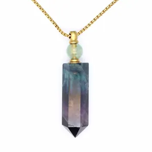 Detailed view of natural stone hexagonal crystal perfume bottle pendant with gold chain