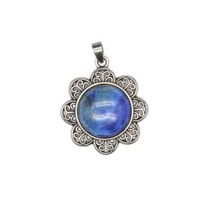 Detail view of the antique silver flower pendant featuring a blue natural stone inlay design