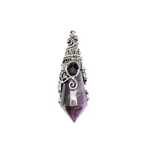 Macro detail showing the intricate silver wire wrap on a faceted amethyst crystal pendant