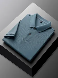 Detail of 100% cotton pique polo shirt for men in slate blue, neatly folded for display
