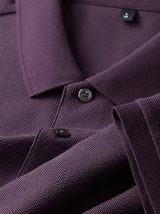 Close-up of premium purple cotton pique Polo shirt with lapel and button detail