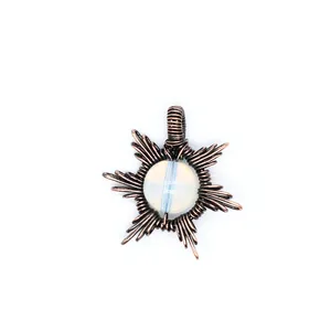 Detailed view of a hand-woven wire-wrapped sun pendant with a round opalite stone center.