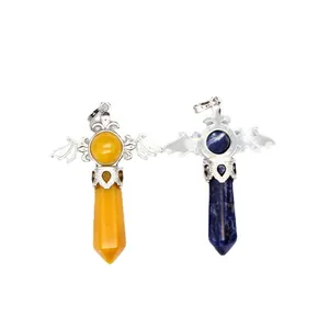 Pair of hexagonal natural stone pendants with silver bat wings on white background.