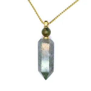 Detail view of a green moss agate hexagonal crystal perfume bottle pendant necklace.