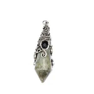 Macro view of the ornate silver wizard hat cap on a faceted labradorite crystal pendant.