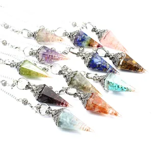 Variety of Chakra crystal resin pendulums featuring crushed stones and copper wire