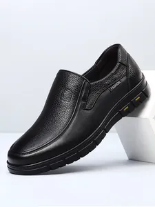 Close-up of black leather casual slip-on shoes with premium cowhide grain texture