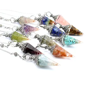 Detail view of hexagonal cone resin pendulums with mixed chakra crystal stones