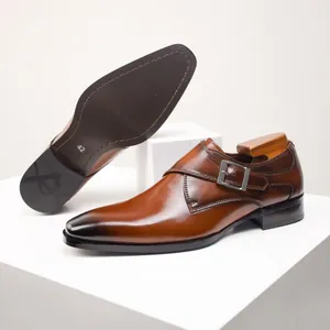 Elegant brown leather monk strap shoes with burnished toe and professional sole detail