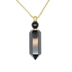 Detail view of hexagonal black stone aromatherapy bottle pendant with gold chain