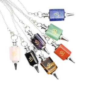 Detailed view of seven colorful crystal stone pendulums with golden Om symbols and chains