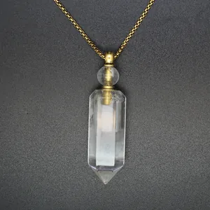 Macro detail of hexagonal pillar crystal aromatherapy bottle necklace with gold chain