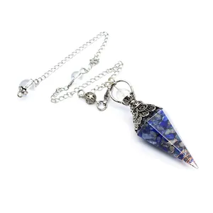 Close-up of hexagonal lapis lazuli resin crystal pendulum with ornate silver chain