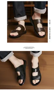 Close-up detail view of men's brown and black leather sandals with textured straps