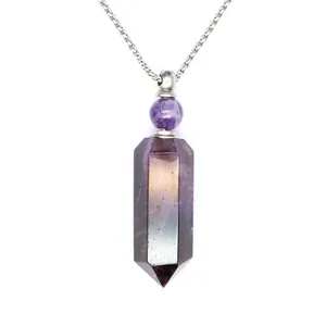 Close-up of hexagonal amethyst crystal pendant with electroplated rainbow finish