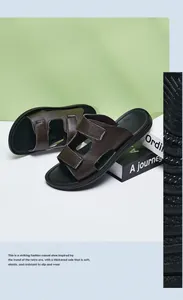 Detail view of men's brown leather-textured slippers with non-slip sole and H-strap.