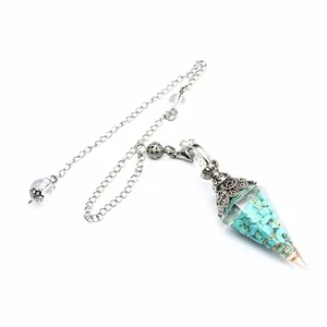 Macro detail of a hexagonal cone pendulum with turquoise crystal stones in resin