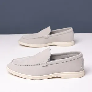 Detailed view of grey suede casual loafers with minimalist slip-on design