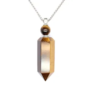 Detailed macro view of a hexagonal tiger eye stone perfume bottle pendant necklace