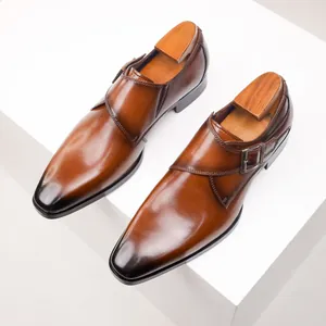 Close-up of brown monk strap leather shoes with burnished toe and wooden shoe trees