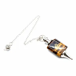 Tiger eye stone dowsing pendulum with gold Om symbol and silver metal chain detail