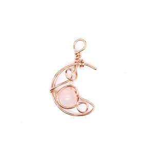 Detailed view of hand-woven rose gold moon pendant featuring natural pink quartz stone