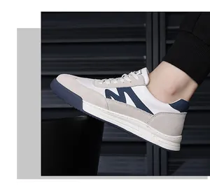 Macro detail of retro men's German Army Trainer sneakers with suede panels and navy M logo